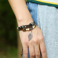 Korean Version Of Imitation Cowhide Bracelet Simple Wild Alloy Leaf Pendant Woven Leather Bracelet main image 5
