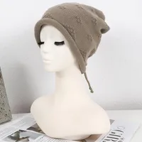 Women's Simple Style Solid Color Flower Drawstring Crimping Wool Cap main image 7