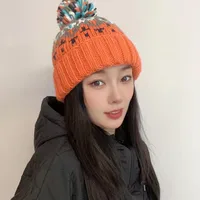 Warm Blue Knitted Hat Female  Fashion Brand Colorful Fur Ball Christmas Hat Autumn And Winter  Ear Protection Wool Hat main image 1
