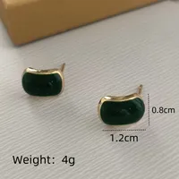 1 Pair Streetwear Commute Triangle Heart Shape Bow Knot Alloy Acrylic Zircon Gold Plated Ear Studs sku image 1