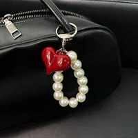 1 Piece Sweet Commute Heart Shape Bow Knot Acrylic Unisex Bag Pendant Keychain main image 2