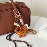 Miu Blogger Same Bag Pendant Alkaline Water Bread Hand Rope Hanging Keychain Accessories Niche High-end main image 1