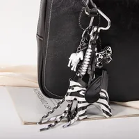 New MIU Cute Leather Pegasus Pendant Pony Bow Woven Rope Keychain Advanced Sense Bag Hanging sku image 1