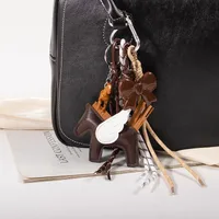 New MIU Cute Leather Pegasus Pendant Pony Bow Woven Rope Keychain Advanced Sense Bag Hanging sku image 3