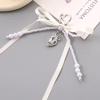 1 Piece Cute Modern Style Classic Style Heart Shape Bow Knot Imitation Pearl Alloy Women's Heart Clasp Closure Bag Pendant Keychain main image 3