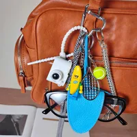 Blue Magnetic Eyeglass Clip Keychain Banana Man Tennis Camera Bag Storage Pendant American Style Mixed Material Keychain Accessory main image 3