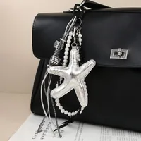 New Sweet Exquisite Glitter Leather Silver Star Keychain Miu Series Pearl Chain Bag Pendant Personalized Design PU Material main image 1