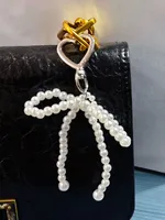Fashionable Black Pearl Butterfly Knot Bag Charm New Style Beaded Handbag Accessory Handmade Painted Design Mixed Material sku image 1