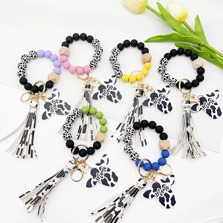 Retro Cow Pattern Alloy Wood Silica Gel Unisex Keychain